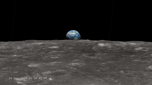 Earthrise photographed from the Apollo spacecraft showing Earth above the lunar horizon