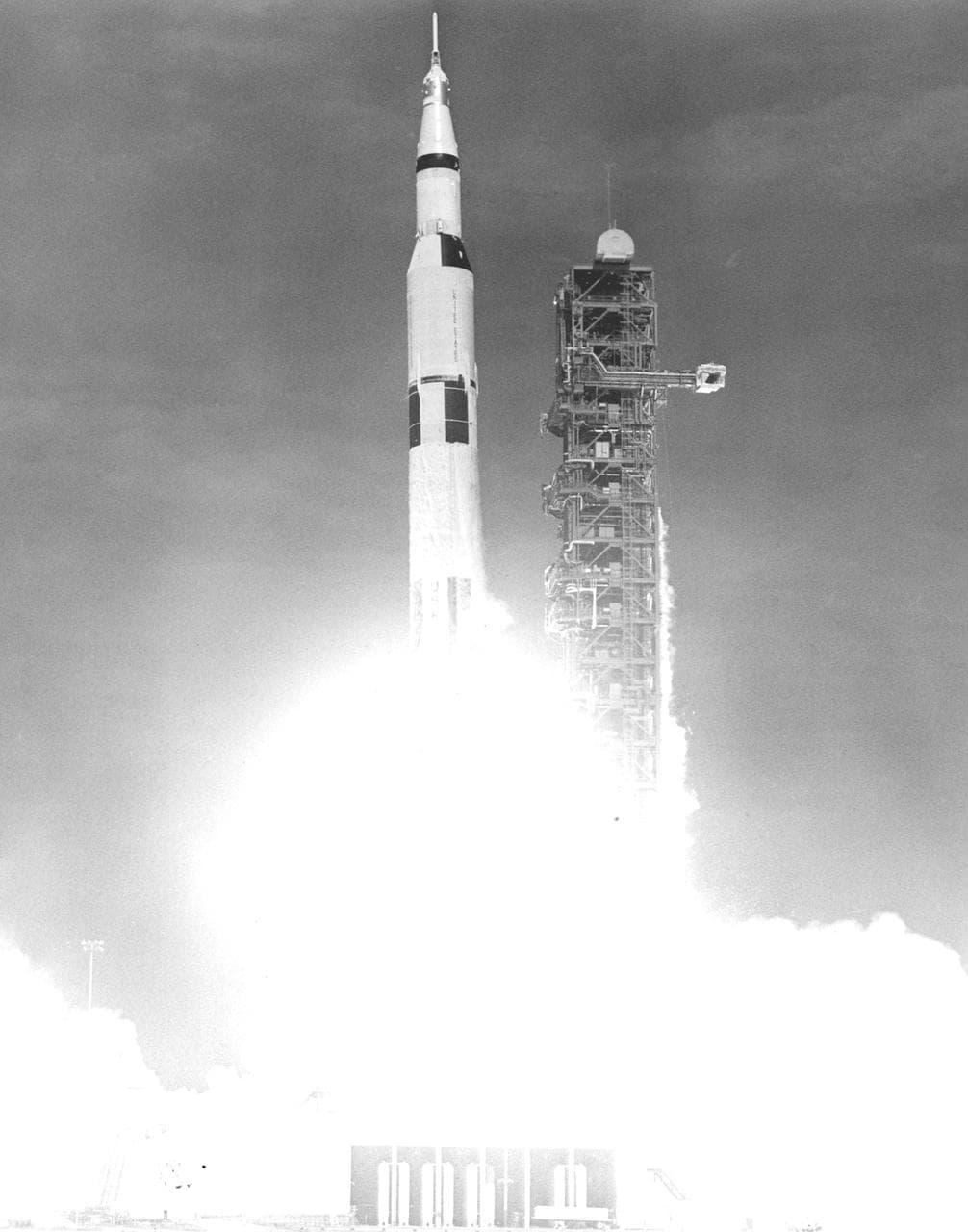 Saturn V rocket lifting off from Kennedy Space Center carrying the Apollo 11 crew