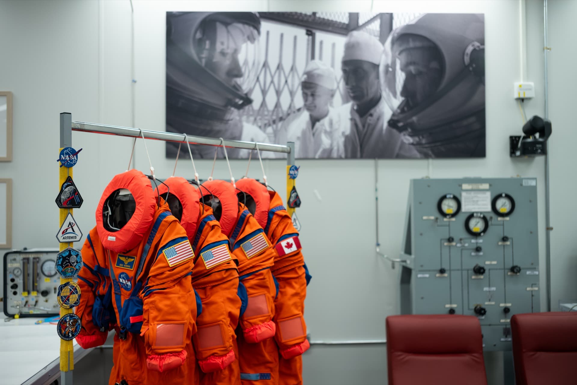 The Orion Crew Survival System suits for the Artemis II crew displayed at Kennedy Space Center