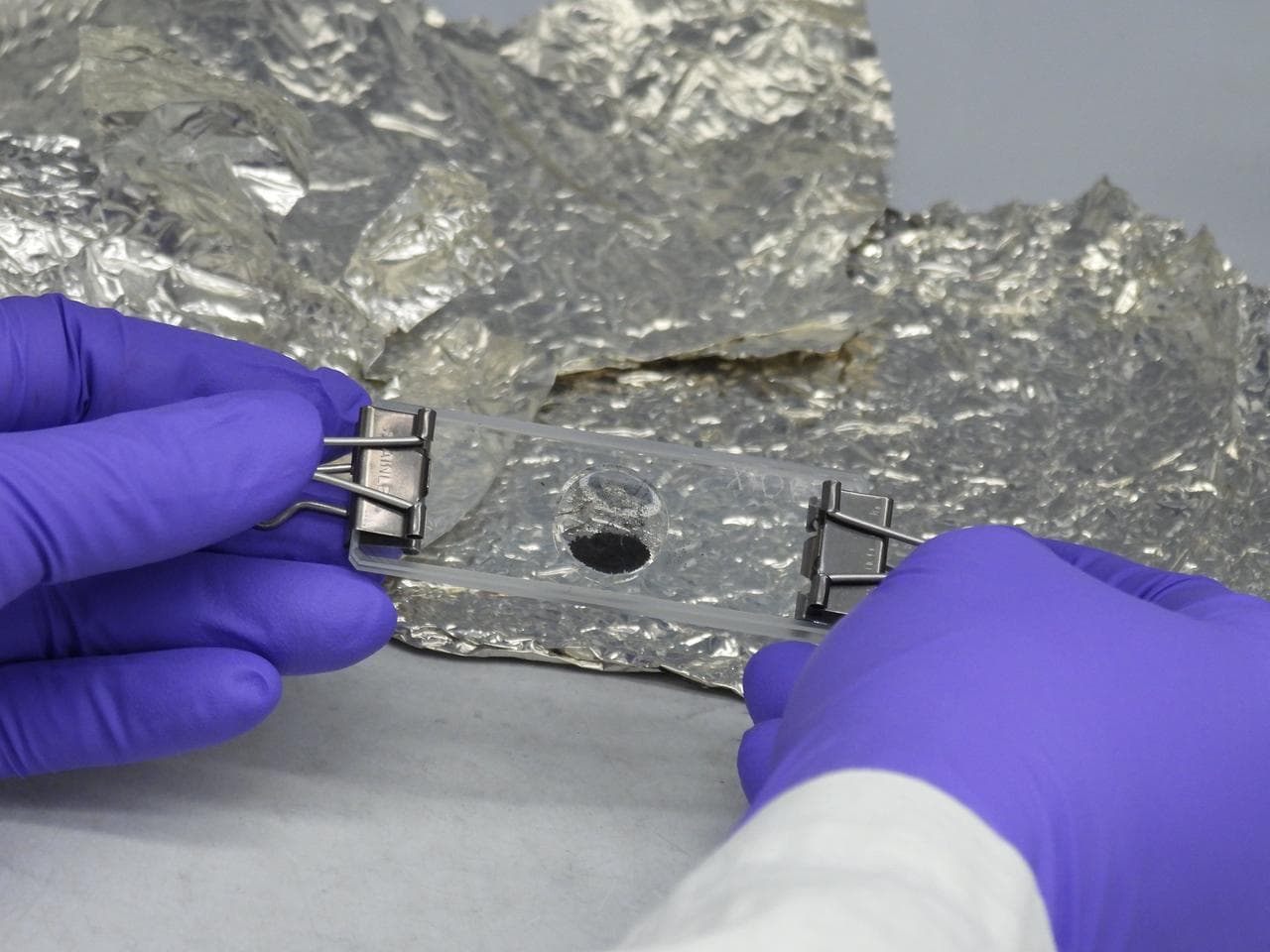 A sealed vial containing 4.5-billion-year-old material from asteroid Bennu