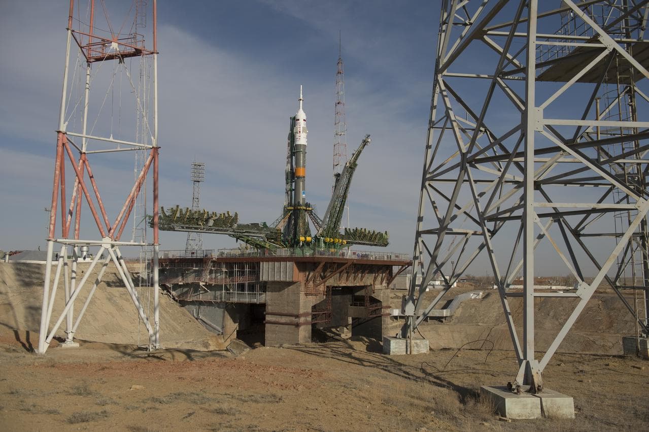 A Soyuz rocket being transported horizontally to the launch pad at Baikonur by rail