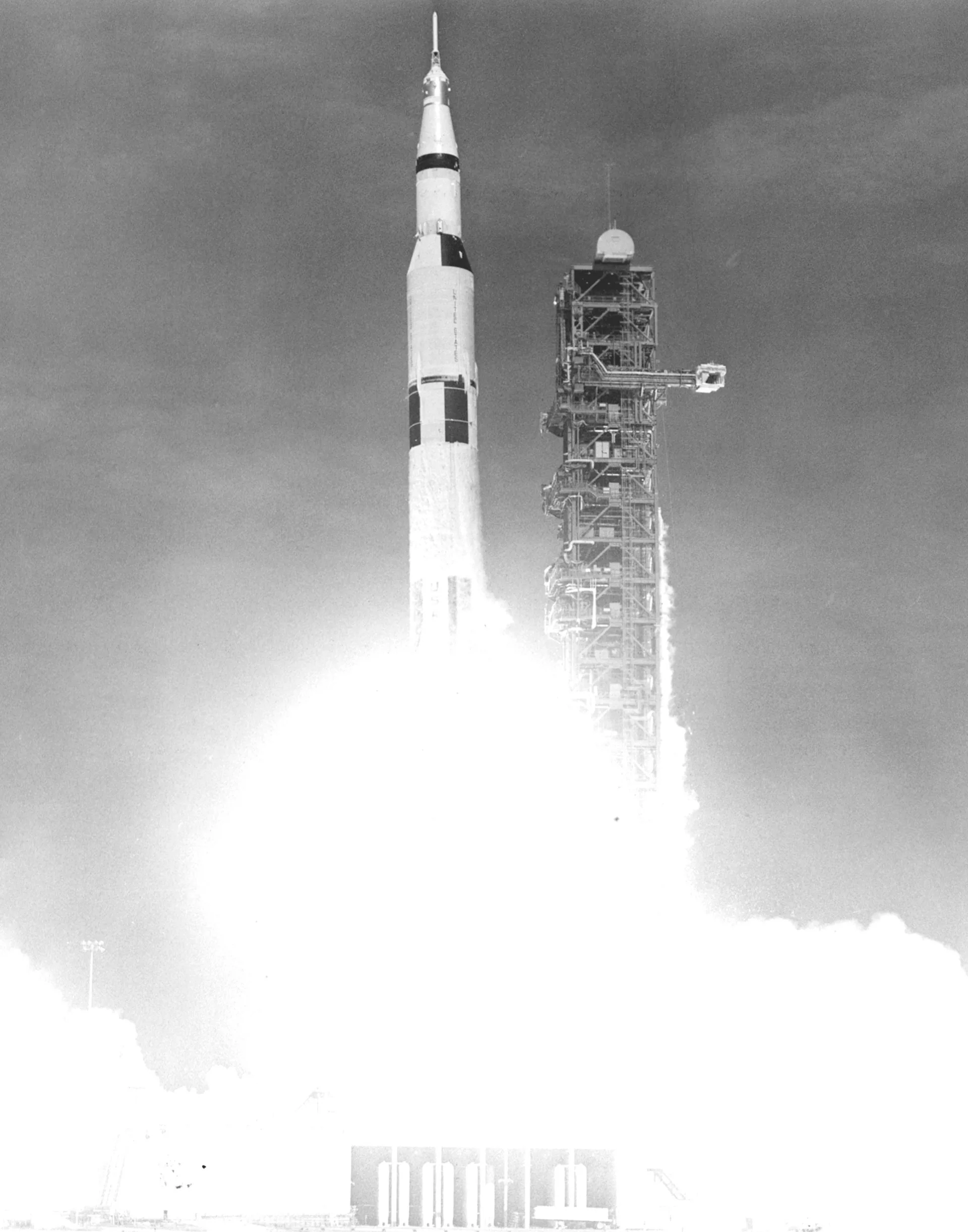 Saturn V rocket lifting off from Kennedy Space Center carrying the Apollo 11 crew