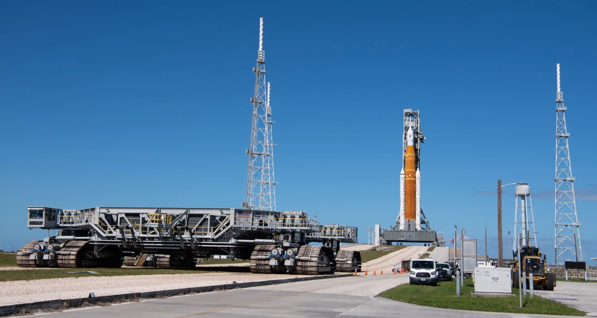 The Artemis SLS rocket on the launch pad at Kennedy Space Center โ a program built on components from Northrop Grumman (solid rocket boosters) and Boeing (core stage), illustrating the defense-industrial coalition behind NASA's flagship mission