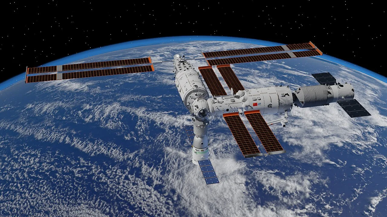 Rendering of China's Tiangong Space Station in its T-shaped three-module configuration above Earth