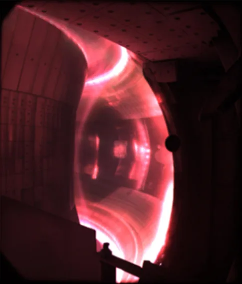 Pinkish-red fusion plasma confined inside the EAST tokamak vacuum vessel at the Hefei Institute of Plasma Physics
