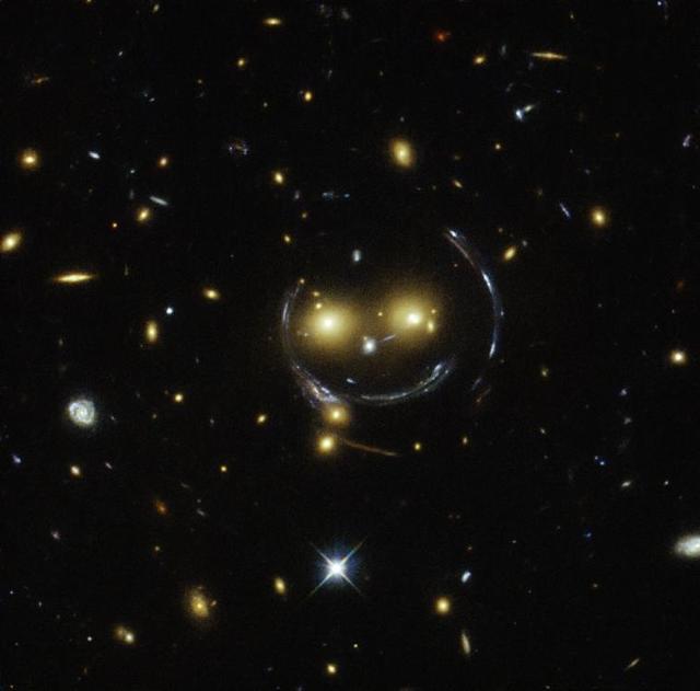 Gravitational lensing effect showing distant galaxies distorted by a massive foreground object