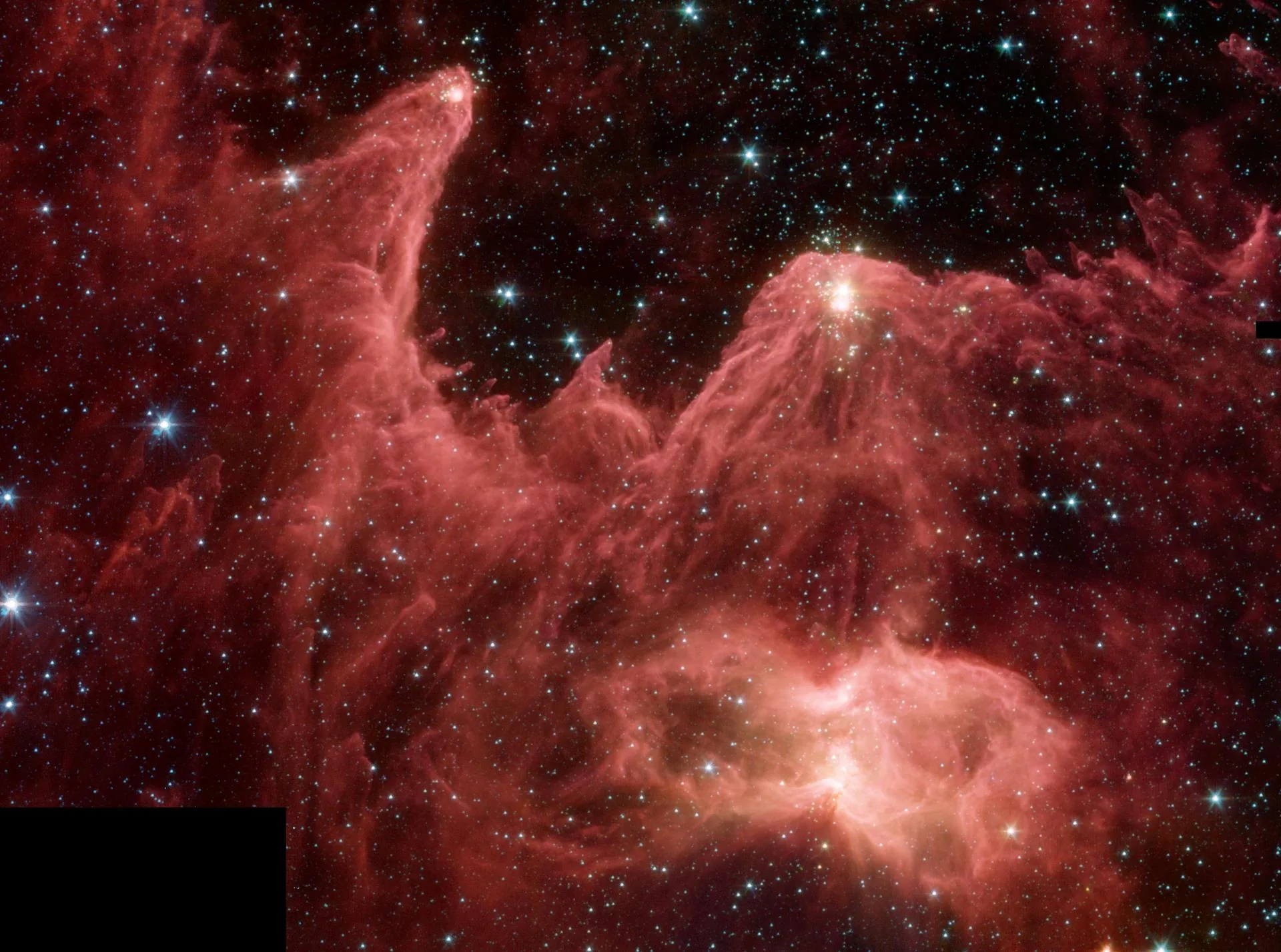 Hubble's iconic Pillars of Creation image showing towering columns of gas in the Eagle Nebula