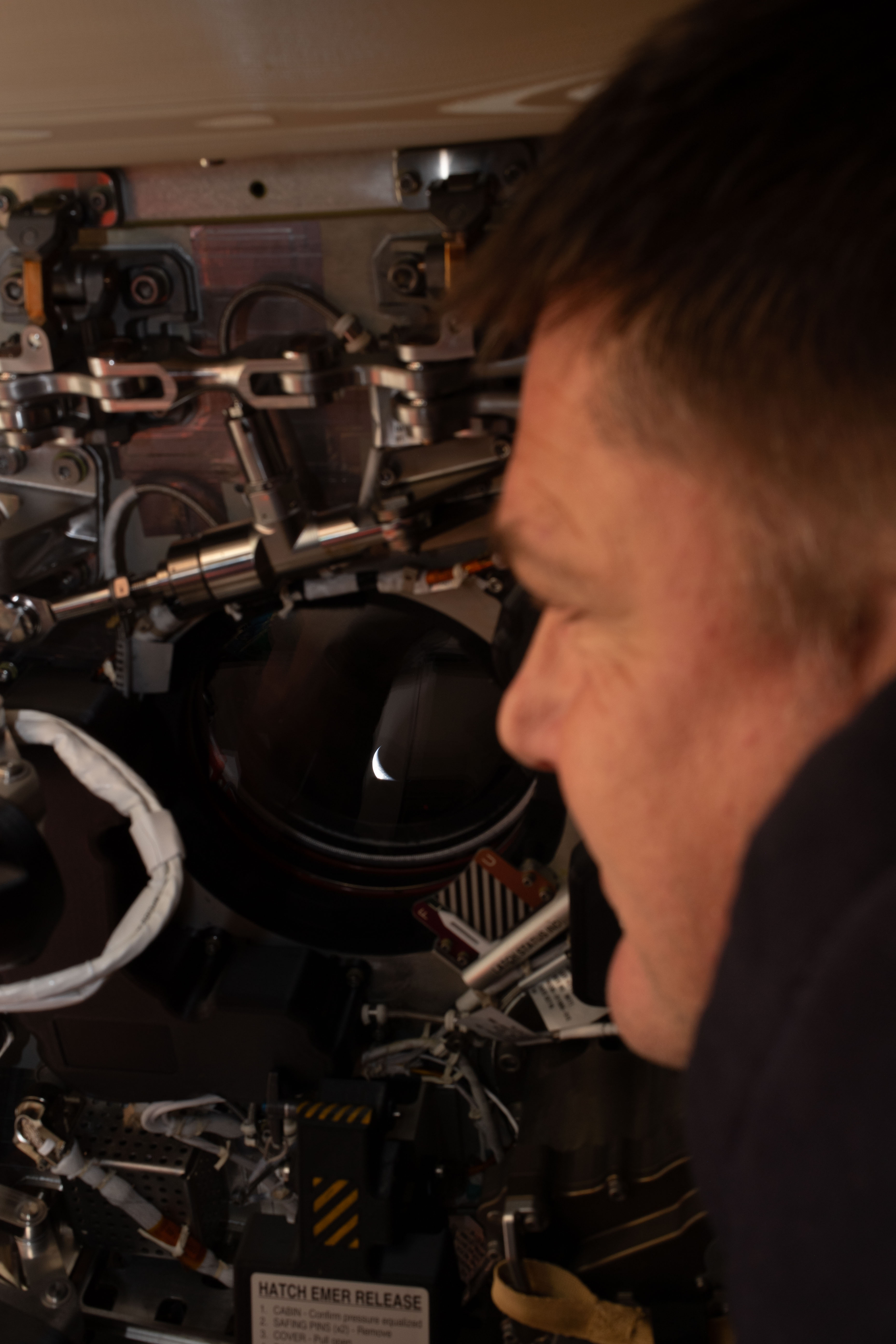 CSA Mission Specialist Jeremy Hansen looks back at Earth from the Orion spacecraft during the Artemis II mission, April 6, 2026. Credit: NASA/CSA