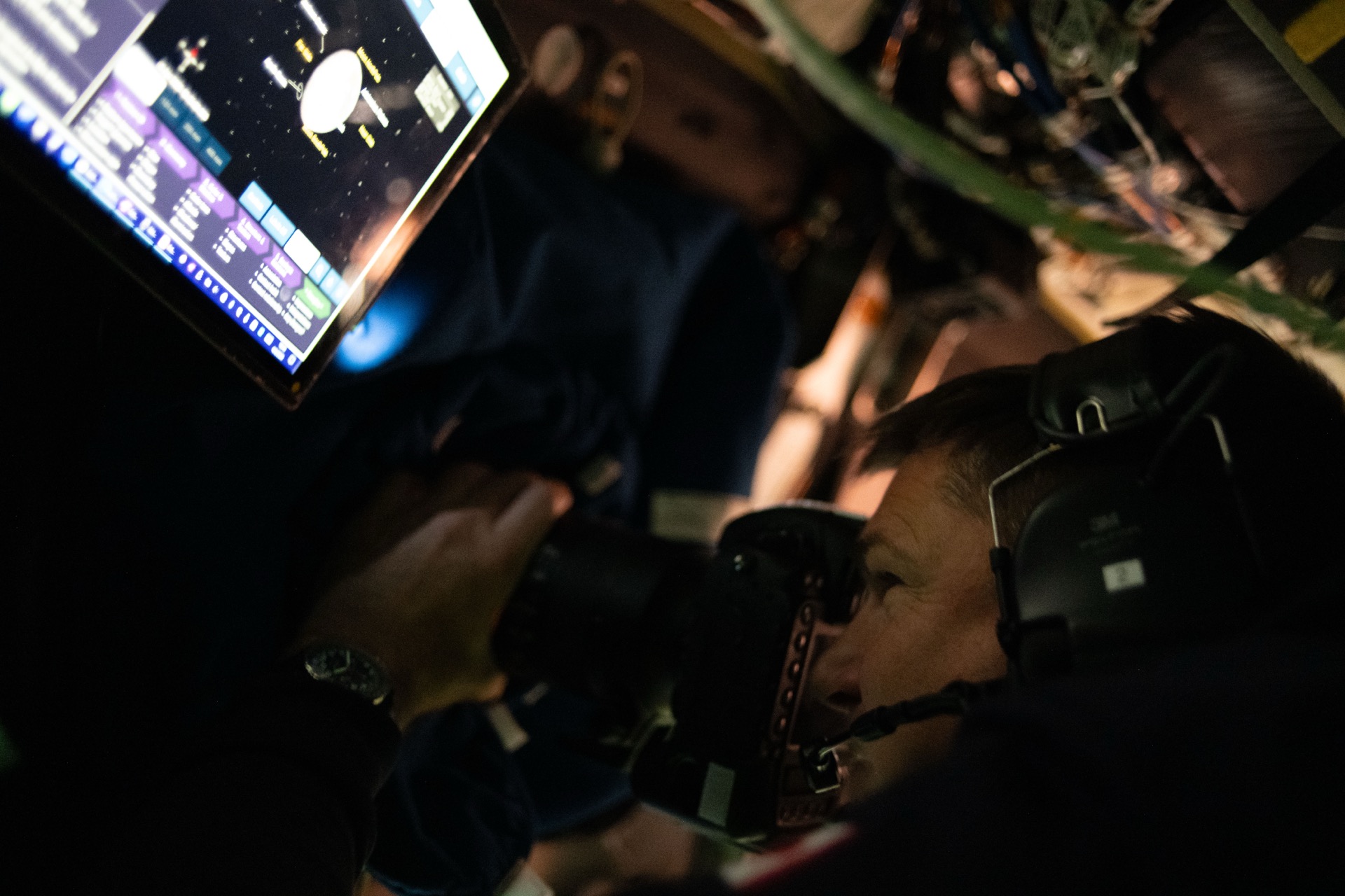 CSA Mission Specialist Jeremy Hansen photographs the lunar surface through Orion's window during the Artemis II flyby, April 8, 2026. Credit: NASA/CSA