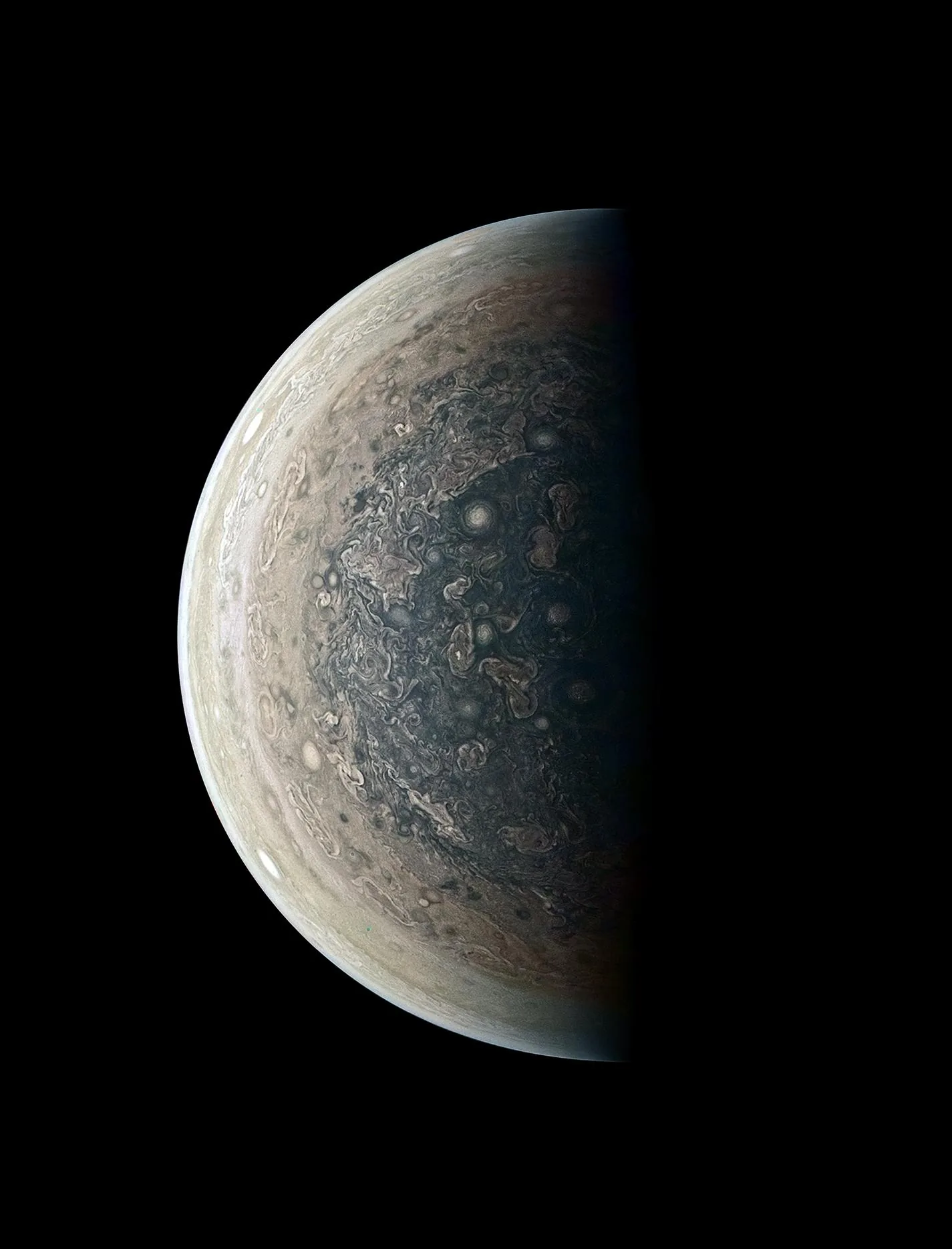 Jupiter's south pole photographed by Juno — a vortex of cyclones unlike anything in the solar system