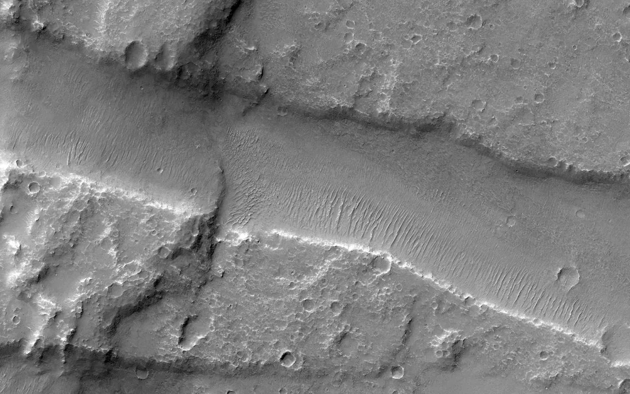 Valles Marineris stretching 4,000 kilometres across the Martian surface — the largest canyon system in the solar system