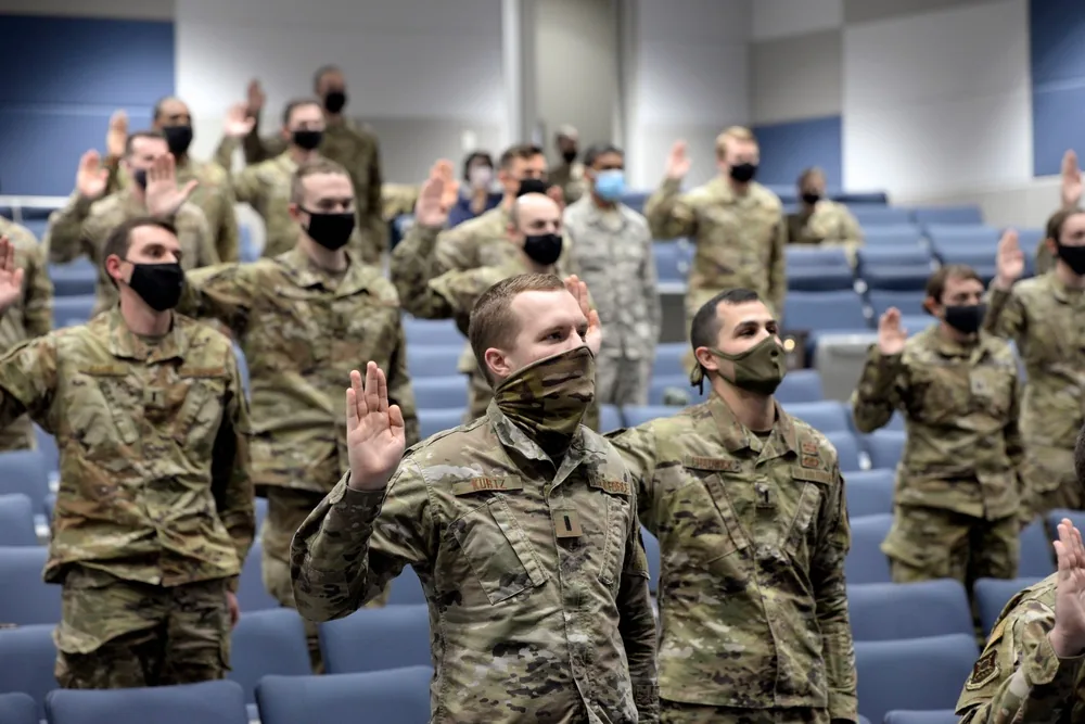 Newly enlisted Guardians take the oath of office during a livestreamed U.S. Space Force ceremony from Wright-Patterson Air Force Base, Ohio, in February 2021