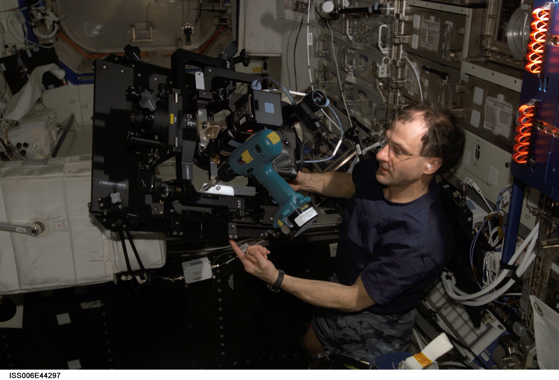 Scientists and astronauts conducting materials science and biological research in the ISS laboratory environment — the foundation of decades of microgravity manufacturing knowledge