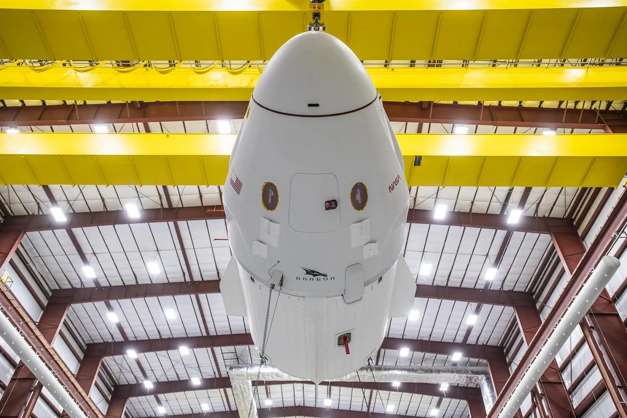 A SpaceX Dragon spacecraft undocking from the ISS — the same vehicle platform that carried the Polaris Dawn crew to their record-altitude orbit