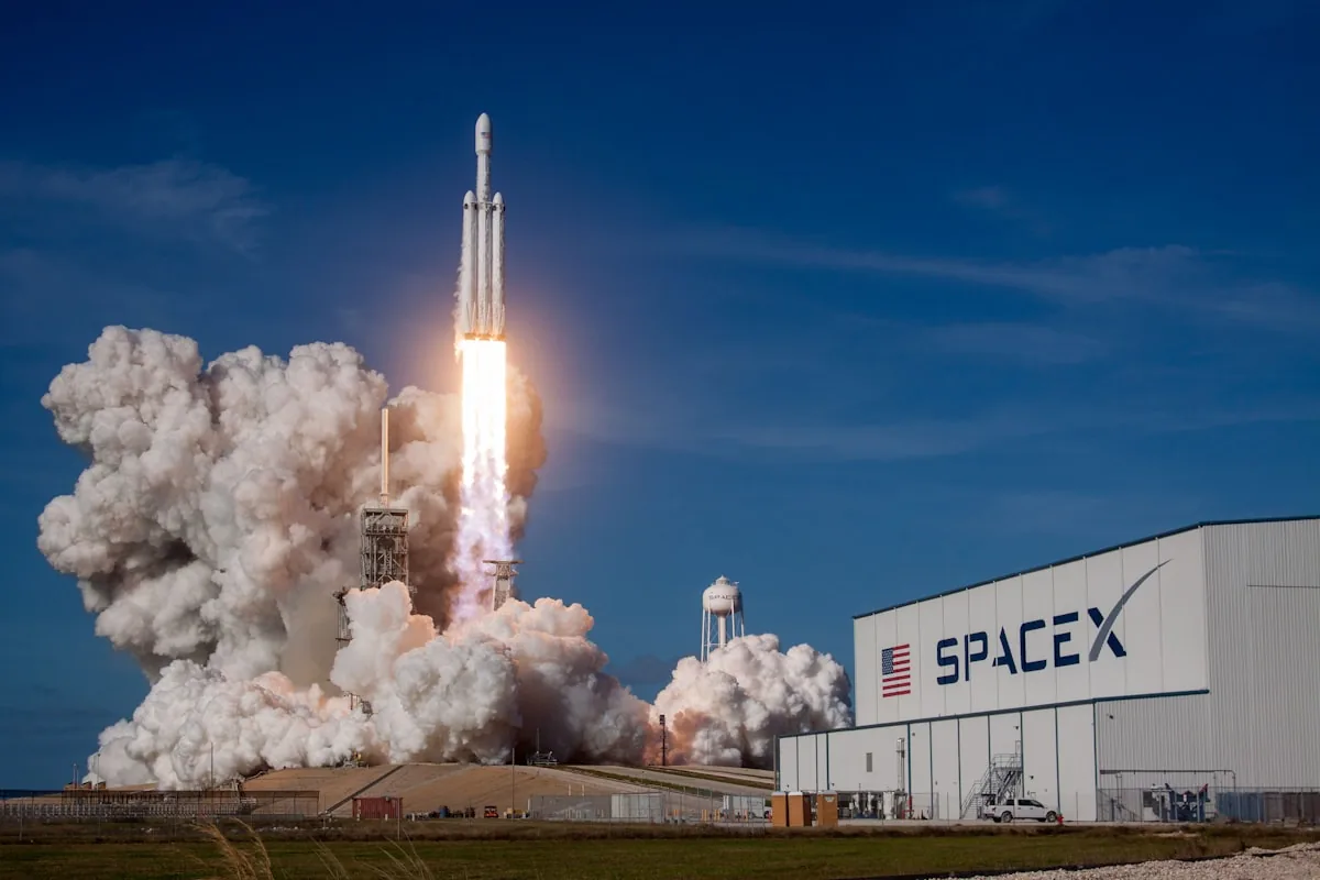 Starship's Super Heavy booster caught by the Mechazilla tower arms
