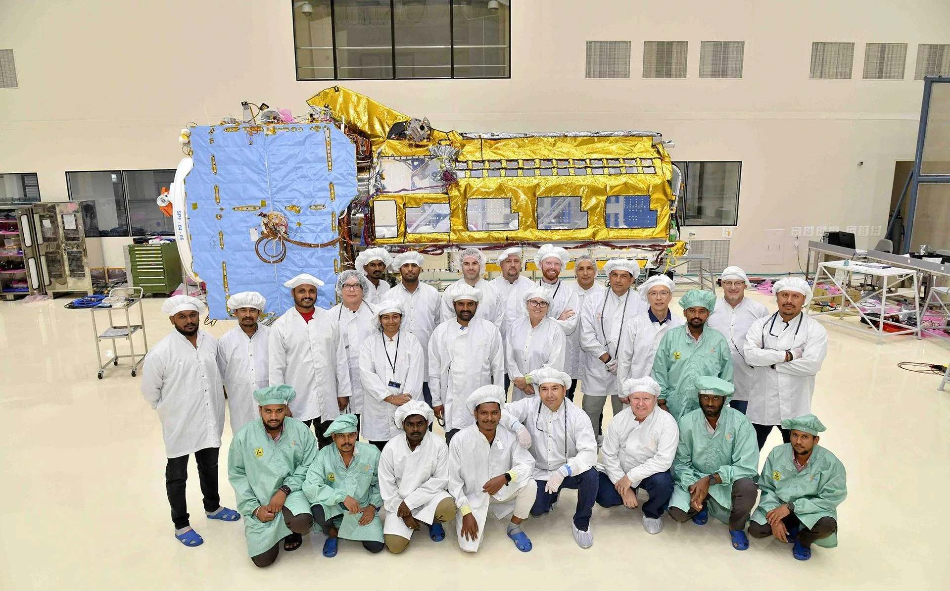 U.S. and Indian engineers collaborating to assemble the NISAR satellite, illustrating the kind of international space technology partnerships that have dual civilian and defense applications