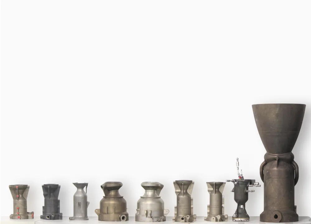 Agnikul's single-piece 3D-printed rocket-engine hardware, from small thrust chambers up to the full Agnilet semi-cryogenic engine.