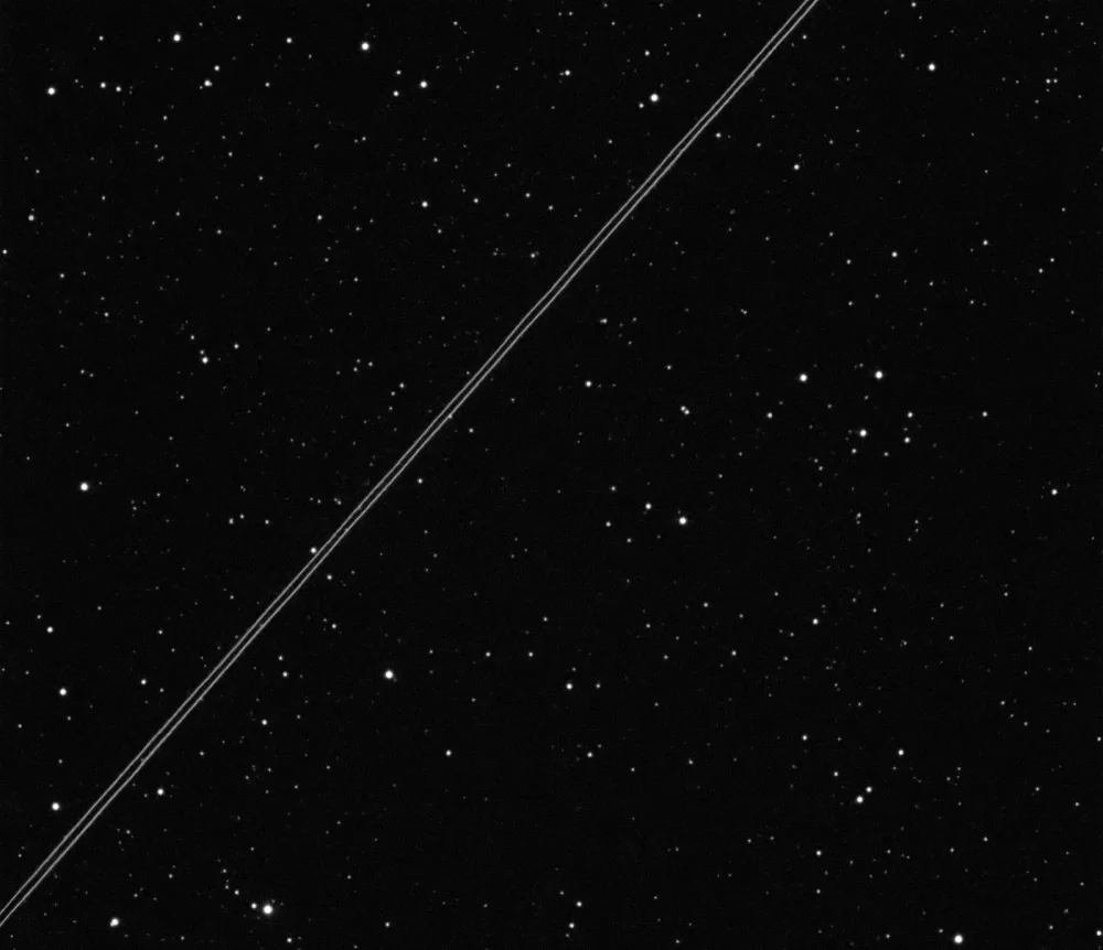 BlueWalker 3 passes over Ckoirama Observatory, its phased-array antenna unfolding in low Earth orbit.