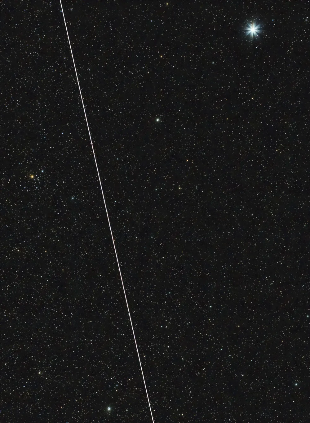 BlueWalker 3 streaks past the bright star Vega over Tucson, Arizona.