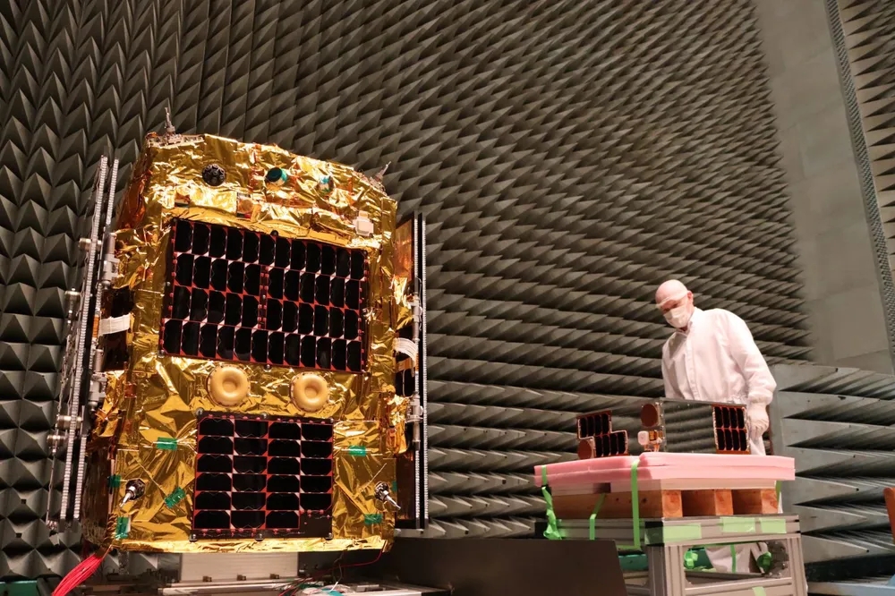 Astroscale's ELSA-d debris-removal demonstration servicer being prepared in a cleanroom ahead of launch.