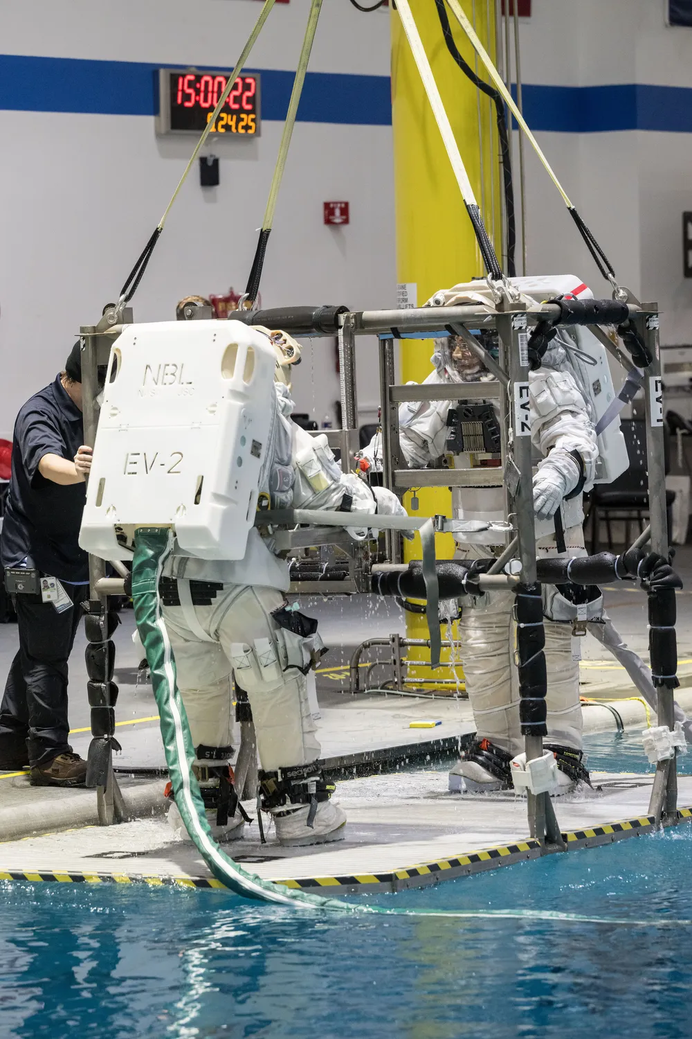NASA astronauts test Axiom's AxEMU lunar spacesuit at the Neutral Buoyancy Laboratory.