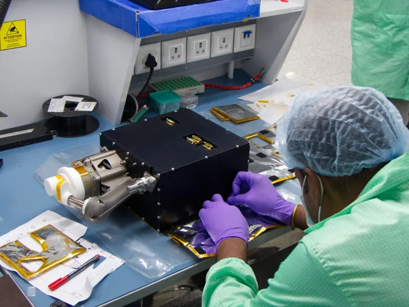 An engineer integrates a Bellatrix propulsion unit in the company's Bengaluru cleanroom.