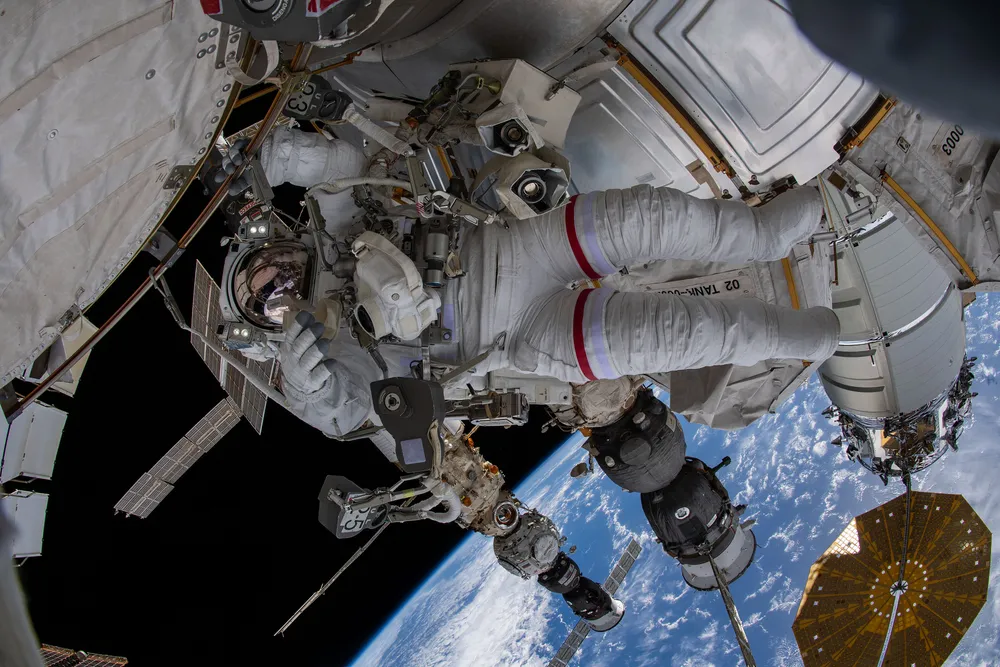 NASA astronaut Raja Chari conducts a spacewalk in the ISS EMU spacesuit during Expedition 66.