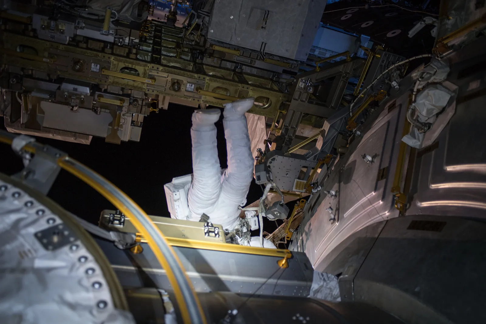 NASA astronaut Ricky Arnold conducts a spacewalk in the ISS Extravehicular Mobility Unit (EMU) spacesuit at the Quest airlock, March 2018.