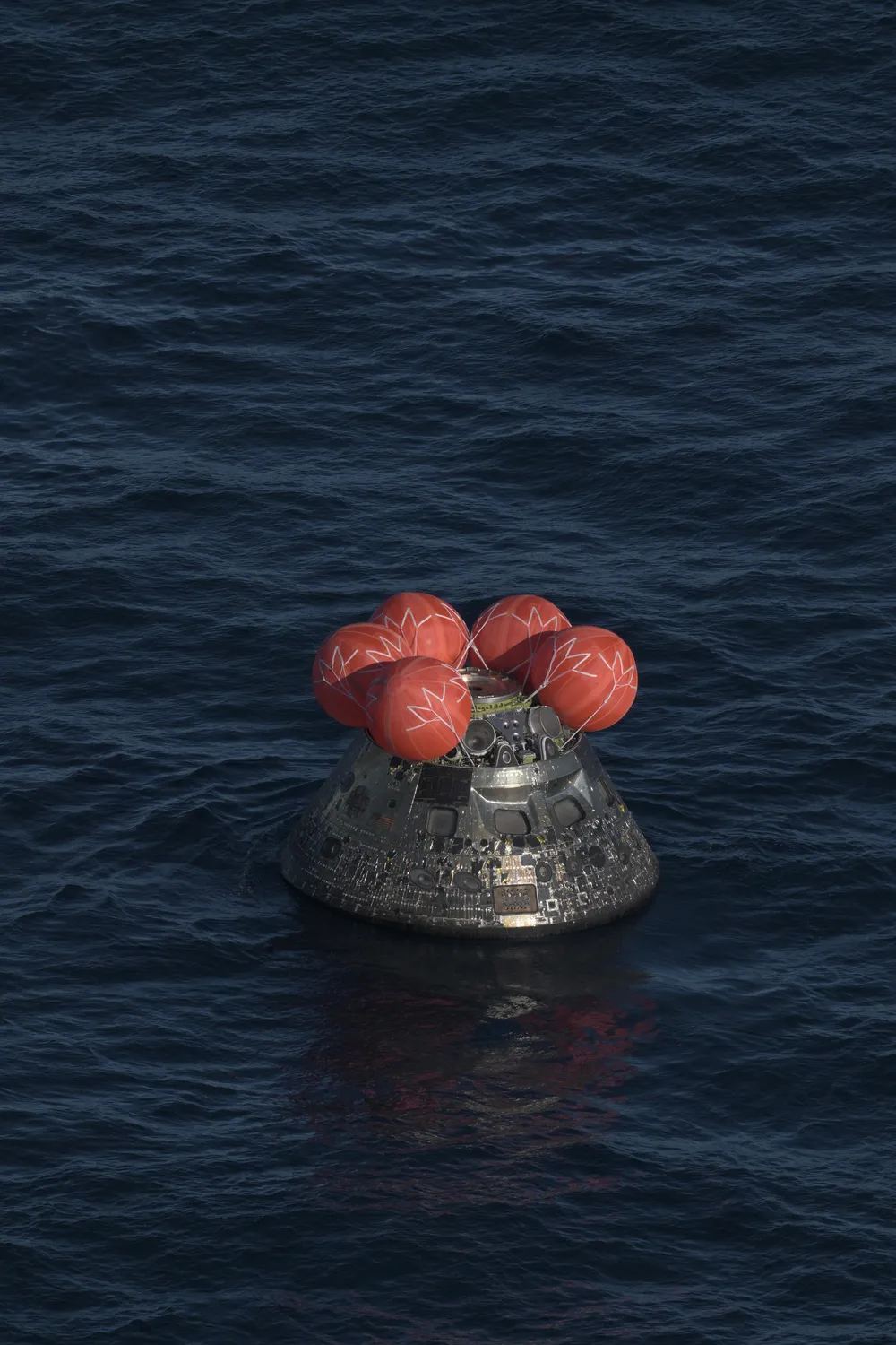 The Orion capsule splashes down in the Pacific concluding Artemis II, April 2026.