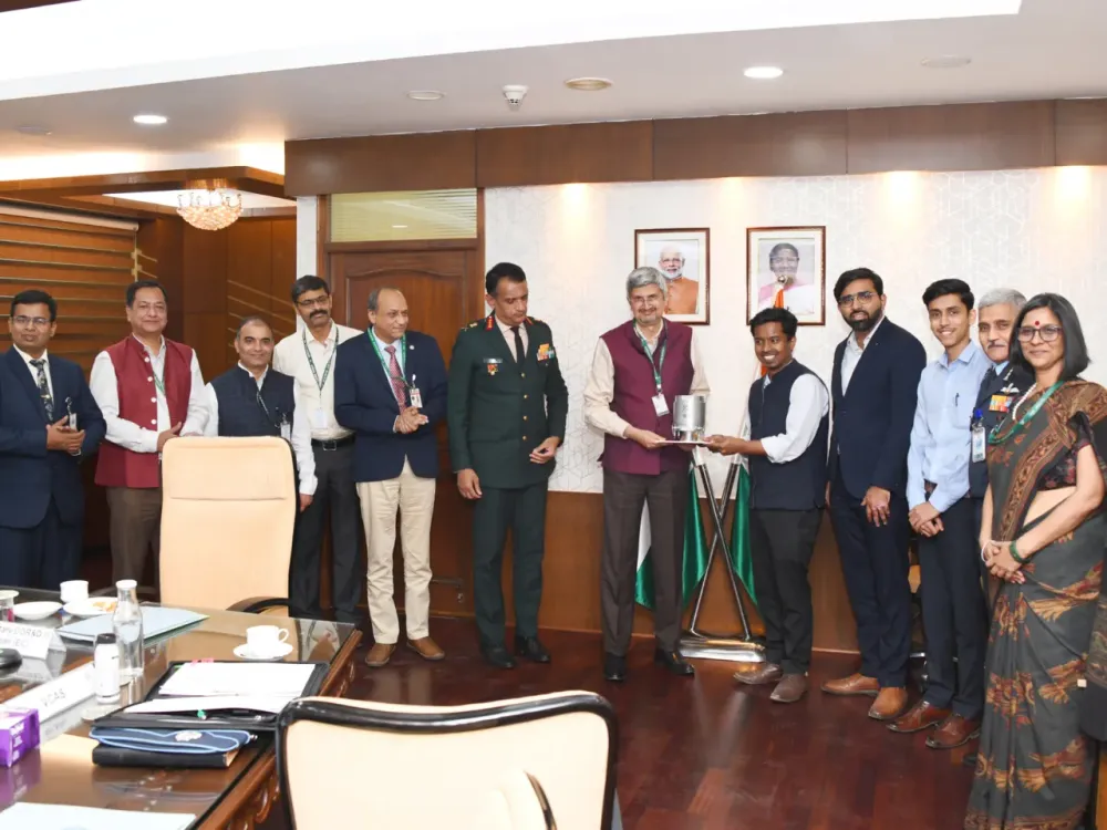 Manastu Space co-founders and team hand over India's first green-propulsion system (iBooster) to DRDO officials at a ceremony, December 2024.