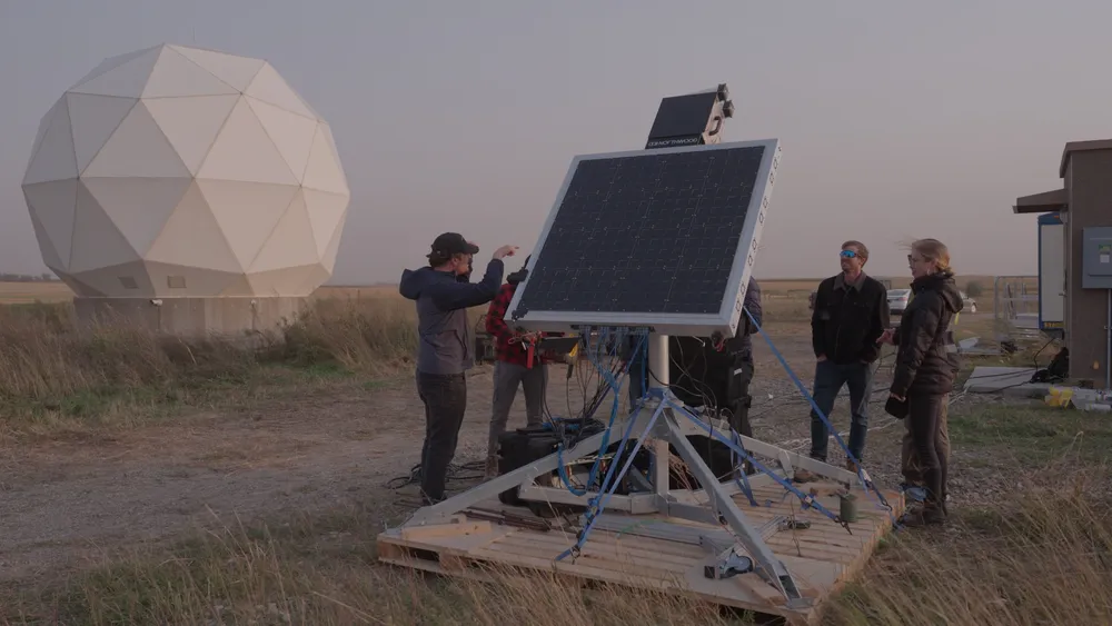 Northwood Space's first phased-array ground station under field test beside a geodesic radome during its October 2024 Planet Labs satellite-link demonstration.