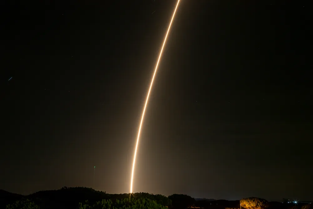 MIURA 1 climbs over El Arenosillo, Huelva, leaving an exhaust trail against the night sky, 7 October 2023.