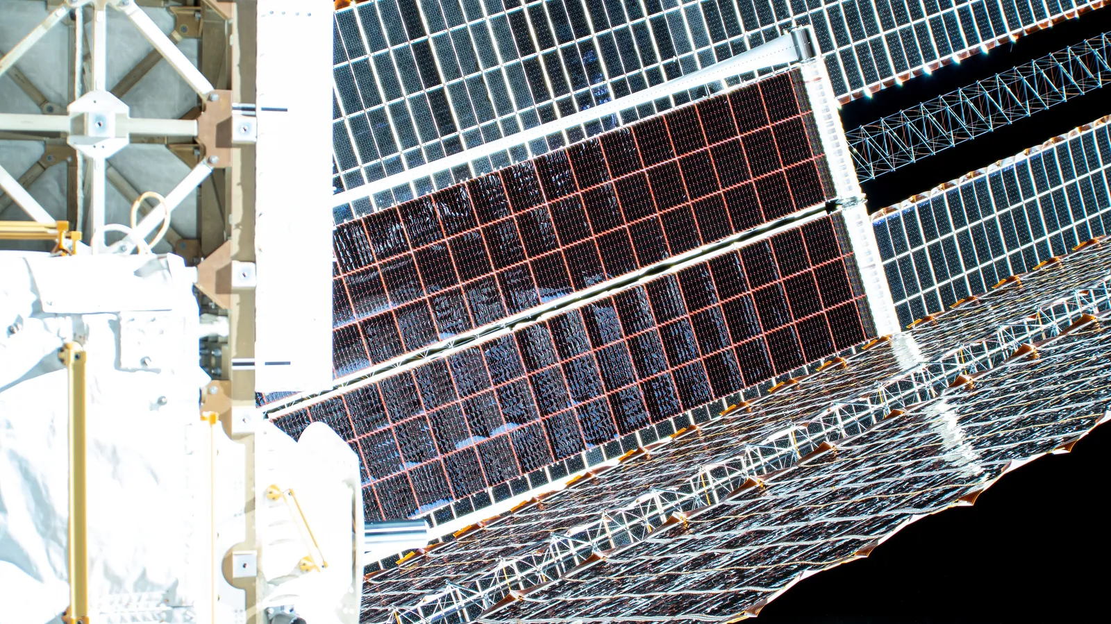 A Redwire-built roll-out solar array (iROSA) fully deployed on the International Space Station's truss.