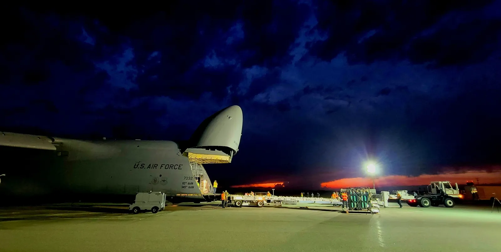 A SBIRS missile-warning satellite is offloaded at Cape Canaveral — Raytheon (RTX) builds the infrared sensor payload (the bus is Lockheed Martin's).