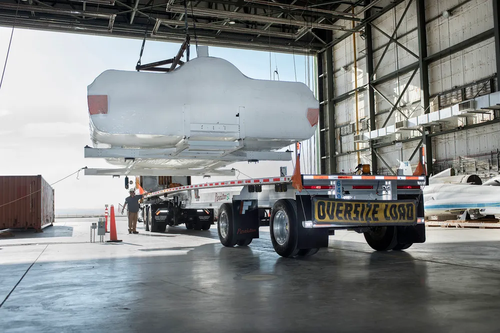 The Dream Chaser spaceplane inside NASA Armstrong's historic shuttle hangar during flight-test prep.