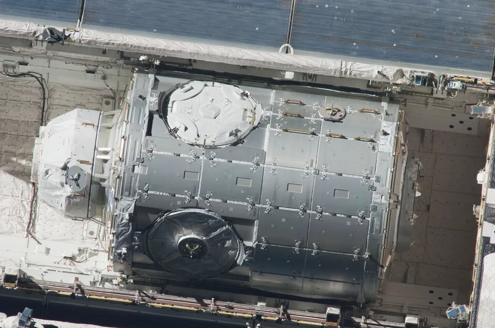 The Tranquility (Node 3) module and Cupola in Space Shuttle Endeavour's cargo bay before installation — both built by Thales Alenia Space.