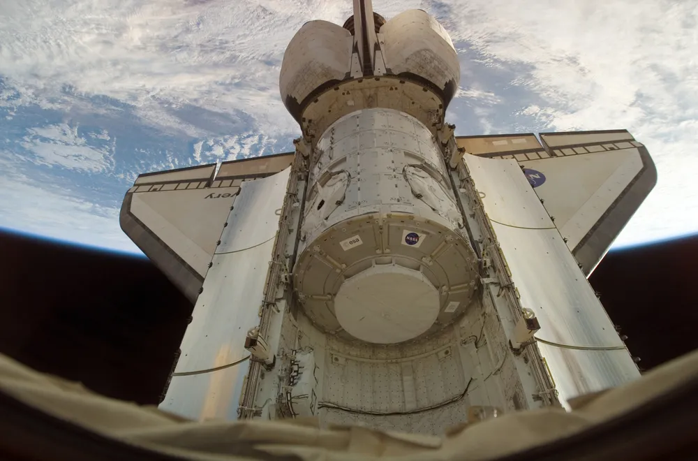 The Harmony (Node 2) module, built by Thales Alenia Space, above Earth during STS-120.