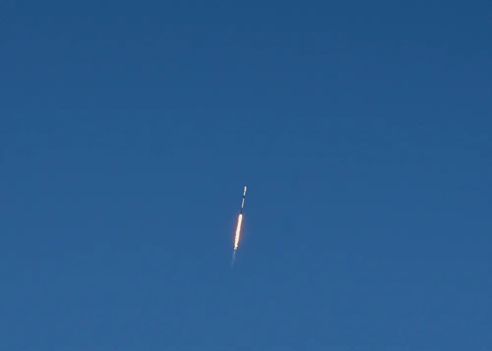 A Falcon 9 carrying the Transporter-3 rideshare payload climbs from Cape Canaveral, January 2022. Illustrative of Varda's launch profile.