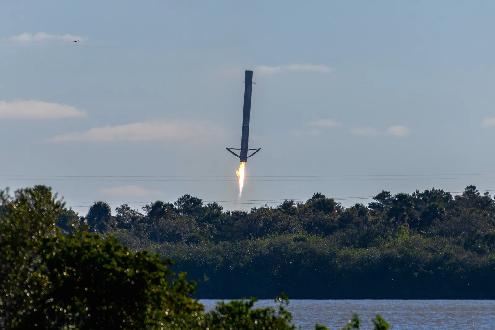 A SpaceX Falcon 9 lifts off on a Transporter rideshare mission from Cape Canaveral — the ride profile Varda's reentry capsules use to reach orbit. Illustrative; not a Varda mission.
