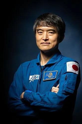 Takuya Onishi in his JAXA flight suit aboard the ISS.