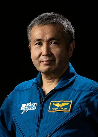 Koichi Wakata in his JAXA flight suit, Japan's most experienced astronaut.