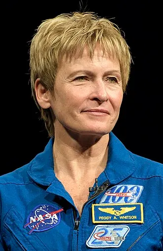 Peggy Whitson in her NASA flight suit, the most experienced American astronaut.