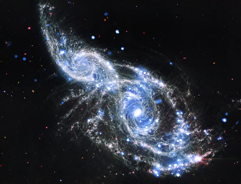 NGC 2207 and IC 2163: A Pair of Galactic Cornucopia