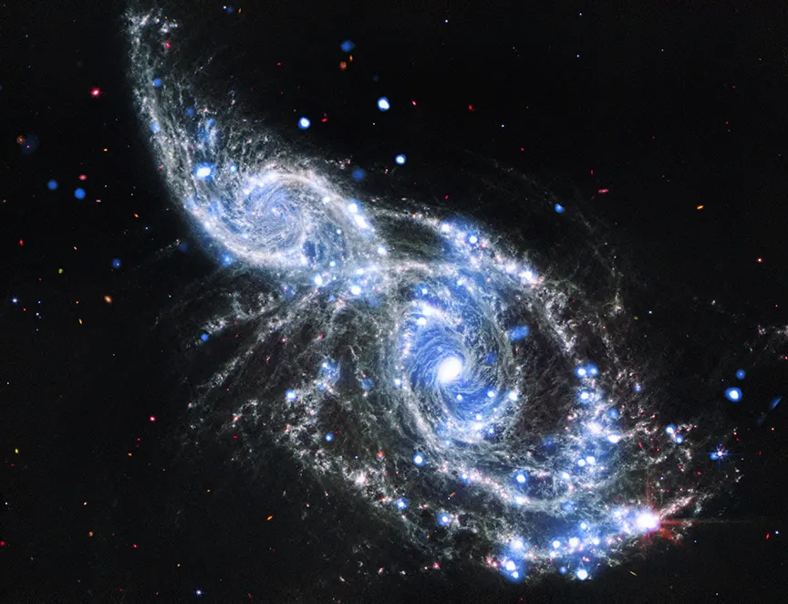 NGC 2207 and IC 2163: A Pair of Galactic Cornucopia