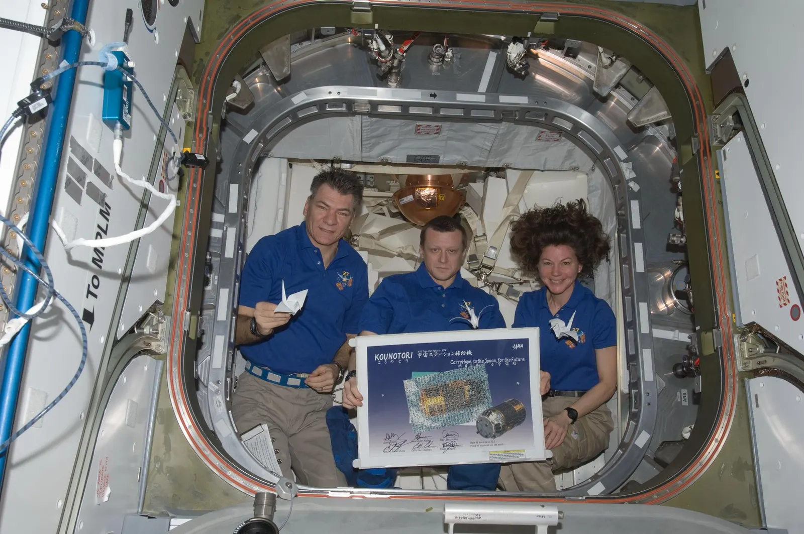 Expedition 6 crew poster featuring Ken Bowersox, Nikolai Budarin and Don Pettit