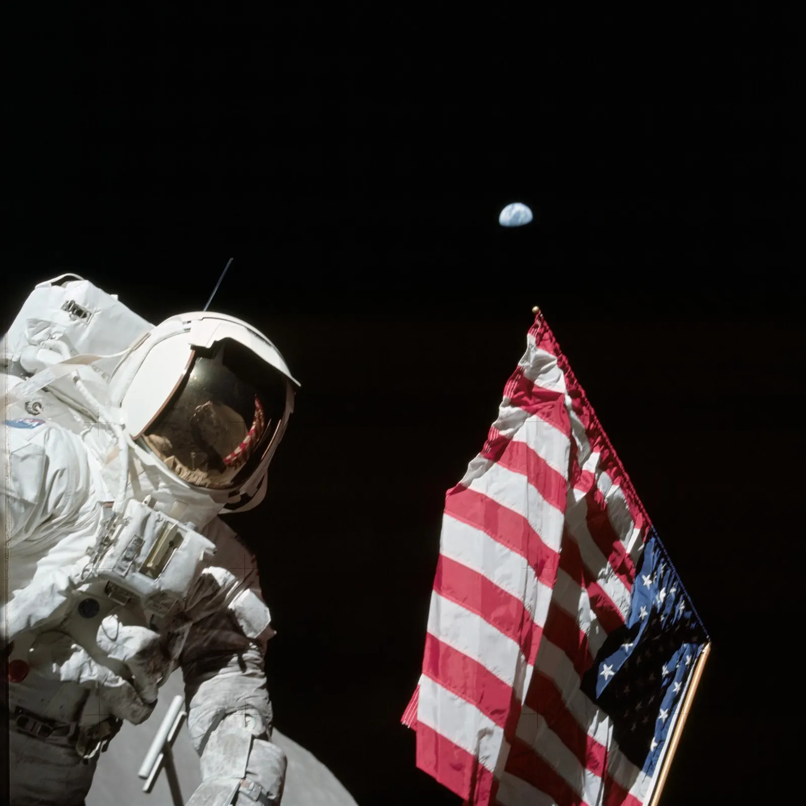 Apollo 17 astronaut Jack Schmitt next to the deployed US flag on the lunar surface