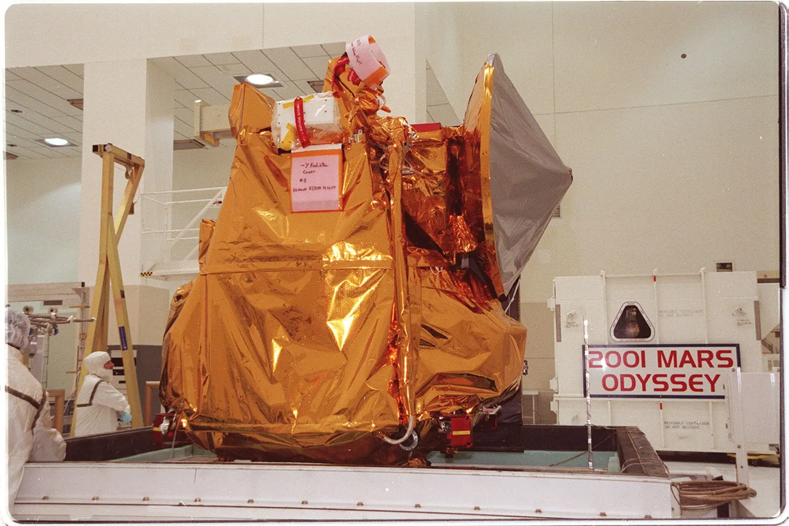The 2001 Mars Odyssey orbiter on its workstand during final assembly at Kennedy Space Center, 2001