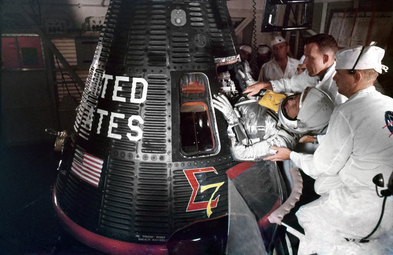 Wally Schirra boards the Sigma 7 spacecraft at Cape Canaveral's Launch Complex 14 before the Mercury-Atlas 8 mission on October 3, 1962
