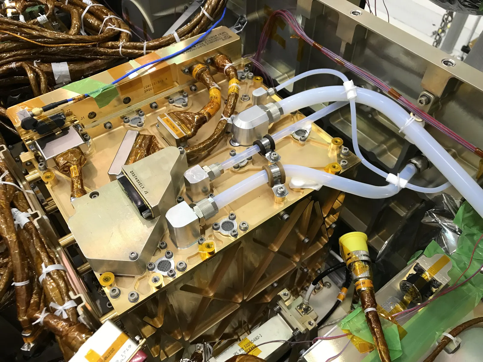 The gold-plated MOXIE instrument installed in the Perseverance rover, which makes oxygen from Mars CO2