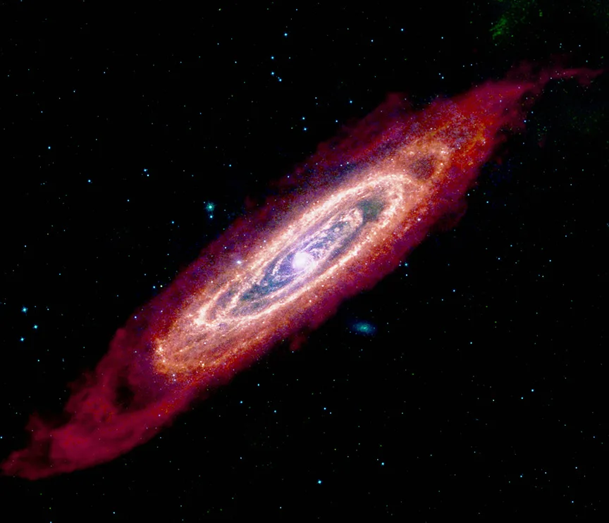 Andromeda Galaxy in infrared — Spitzer MIPS 24 μm imaging reveals M31's famous ~10 kpc cold-dust ring with exquisite clarity, tracing the galaxy's primary star-formation belt invisible at optical wavelengths.